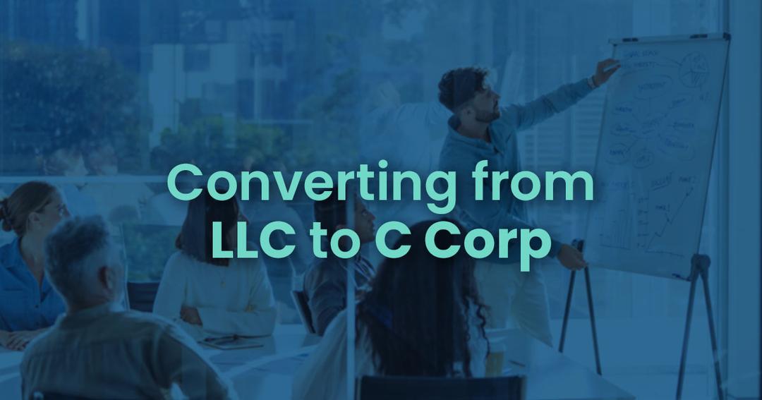 A business presentation in an office setting discussing the transition from llc to c corp, with a speaker pointing at a flip chart and attendees focusing on the presentation.